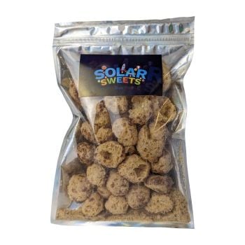 Freeze dried milk duds candy packaged by Solar Sweets.