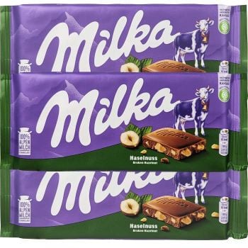 Milka Haselnuss is a milk chocolate bar with broken hazelnut pieces.
